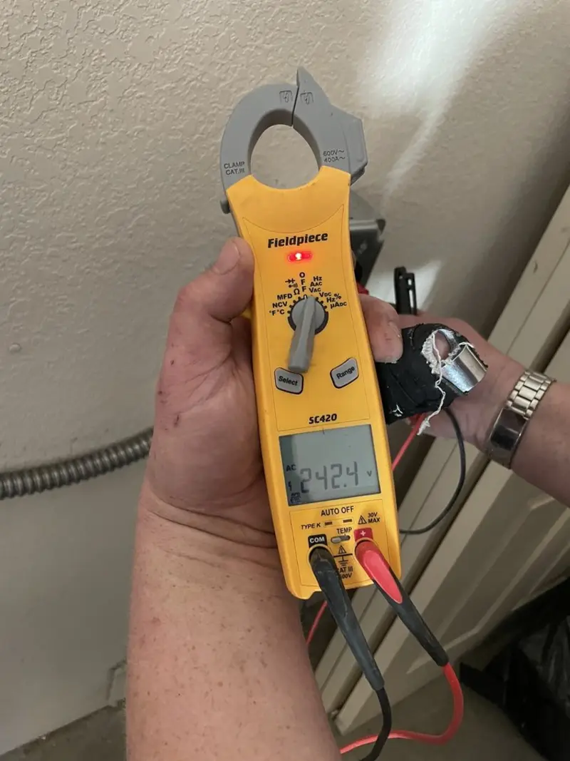Voltage testing with clamp meter during Hot Tub / Pool Electrical Wiring in Delano